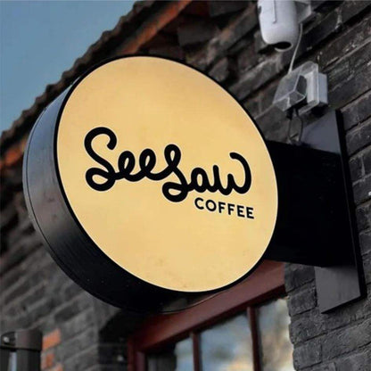 Custom Round Blade Sign with LED Lightbox – Double-Sided Wall Mounted Business Sign for cafés, boutiques, salons, restaurants, and retail storefronts.